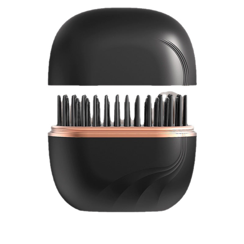 Black hairbrush with rose gold accents on a white background